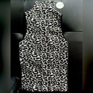 Cheetah print/turtle neck sleeveless top. Stretchy, soft and easy to wear.
